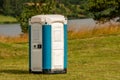 Portable plastic toilet on the meadow