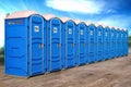 Portable plastic toilets in a row