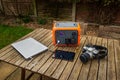 Portable power station solar electricity generator with laptop, tablet and camera charging.