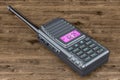 Portable radio walkie-talkie on the wooden table, 3D rendering
