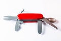 Portable red swiss knife on the white background Royalty Free Stock Photo