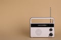 Portable retro radio receiver on beige background. Space for text Royalty Free Stock Photo