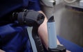 Portable slit lamp for ophthalmic examination of the fundus. In the ophthalmology office, the doctor holds a slit lamp