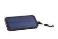 Portable solar charger for smart phone. Royalty Free Stock Photo