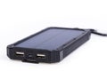 Portable solar charger for smart phone. Royalty Free Stock Photo