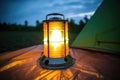 portable solar lantern glowing in dark inside a tent Royalty Free Stock Photo