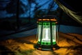 portable solar lantern glowing in dark inside a tent Royalty Free Stock Photo