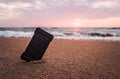 Portable solar panel is on the beach in the sand