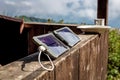 Portable solar panel charges the battery of a powerbank. Royalty Free Stock Photo