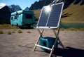 Portable solar panels and battery next to camper van, caravan in mountains. AI generative, AI generated illustration