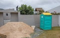 Outdoor portable crapper on a building site Royalty Free Stock Photo