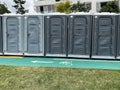 Portable toilets outdoors by a bicycle road. Royalty Free Stock Photo