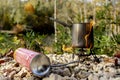 Portable tourist gas stove with a gray kettle on a background of nature in the mountains. Camping kitchen and tea Royalty Free Stock Photo