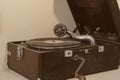 Portable vintage wind-up acoustic gramophone Leophone.Selective focus to needle and old disk of aged retro phonograph.