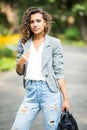 Portait of business woman in eyesglasses walking outdoor