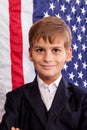 Portait of Caucasian boy with American flag Royalty Free Stock Photo