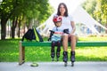 Portait of cute baby boy and his mom wearing inline skates Royalty Free Stock Photo