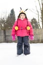 Portait of a little girl in winter clothes having fun in the sno Royalty Free Stock Photo