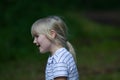 Portait in profile of pretty toddler blond girl talking Royalty Free Stock Photo
