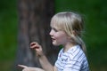 Portait in profile of pretty toddler blond girl talking Royalty Free Stock Photo