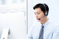 Portait of young handsome male asian call center agent Royalty Free Stock Photo