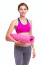 Portait of young woman with yoga mat.