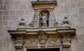 Portal decoration of a boy with cross on Alicante co-cathedral, Spain