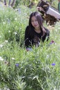 Portarit Thai woman with purple flower garden Royalty Free Stock Photo