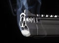 Ported handgun with smoke Royalty Free Stock Photo