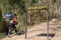 Porter bring baggage and pass pran pran prae stop during hiking to the top of mountain plateau at Phu Kradueng National Park