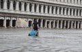 Porter with carriage in Venice during flood