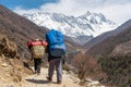 Porter carrying heavy loads walk to Everest base camp, Himalaya mountain, Nepal