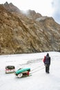 Porter Crossing Frozen Zanskar River. Chadar Trek