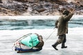 Porter Crossing Frozen Zanskar River. Chadar Trek