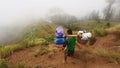 A porter going down from Rinjani mountain, Lombok, Indonesia Royalty Free Stock Photo