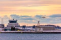 Porter propellor airplane on approach to Billy Bishop Airport at sunset. De Havilland Canada Dash 8 Q400