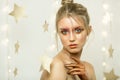 Porter red young girl, beautiful make-up, hairstyle, bright image, stars Royalty Free Stock Photo