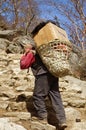 Porters carry heavy load in Himalaya, Nepal Royalty Free Stock Photo