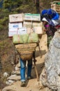 Porters carry heavy load in Himalaya, Nepal Royalty Free Stock Photo
