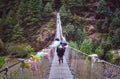 Porters carry heavy load in Himalaya