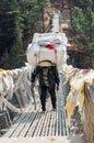 Porters carry heavy load in Himalaya