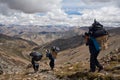 Porters with heavy load in the Himalaya