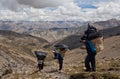 Porters with heavy load in the Himalaya Royalty Free Stock Photo