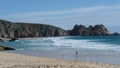 Porth Curno beach and Treen cliffs in Cornwall UK Royalty Free Stock Photo