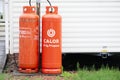 Calor gas cylinder bottles in cage fence at caravan park site in Porthcawl UK