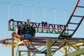 People enjoy the Crazy Mouse ride at Porthcawl, South Wales, UK