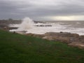 Porthcawl on a stormy day with waves crashing onto rocks, South Wales