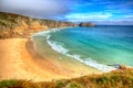 Porthcurno beach Cornwall England UK near the Minack Theatre IN hdr Royalty Free Stock Photo