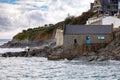 View of the Old Lifeboat House in Porthleven, Cornwall on May 11, 2021. Two unidentified