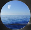 Porthole with blue ocean view